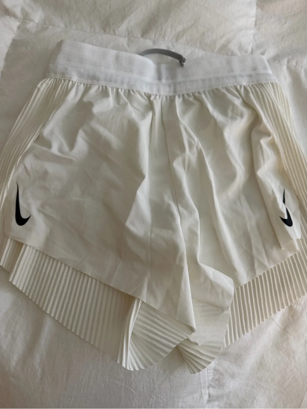 Nike Women's White Athletic Shorts with Black Swoosh